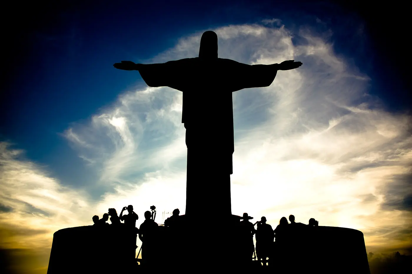 Christ the Redeemer silhouetted against the sunset above Rio de Janeiro